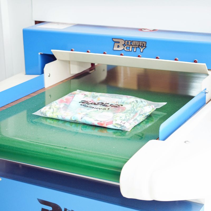 Processo de fabricação de trajes de banho - Máquina detectora de metais