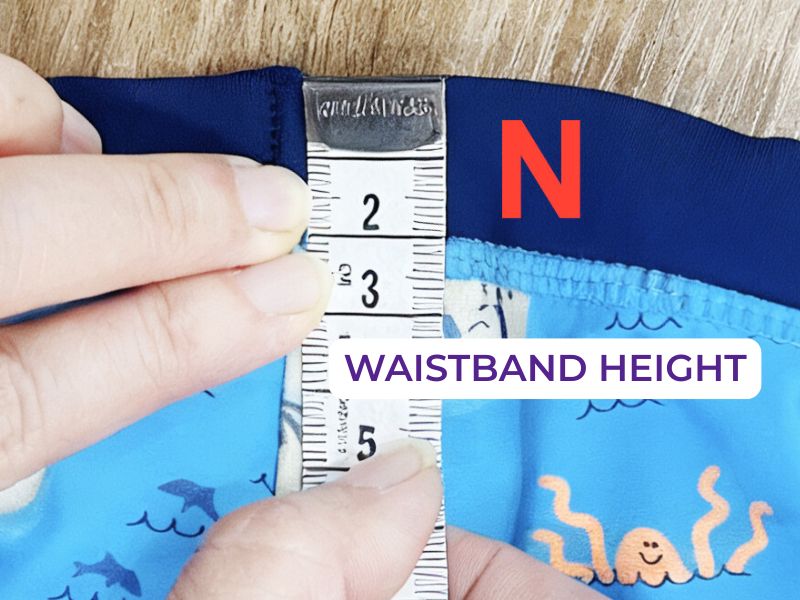 Como medir amostras de roupa de banho - Altura da cintura (N)