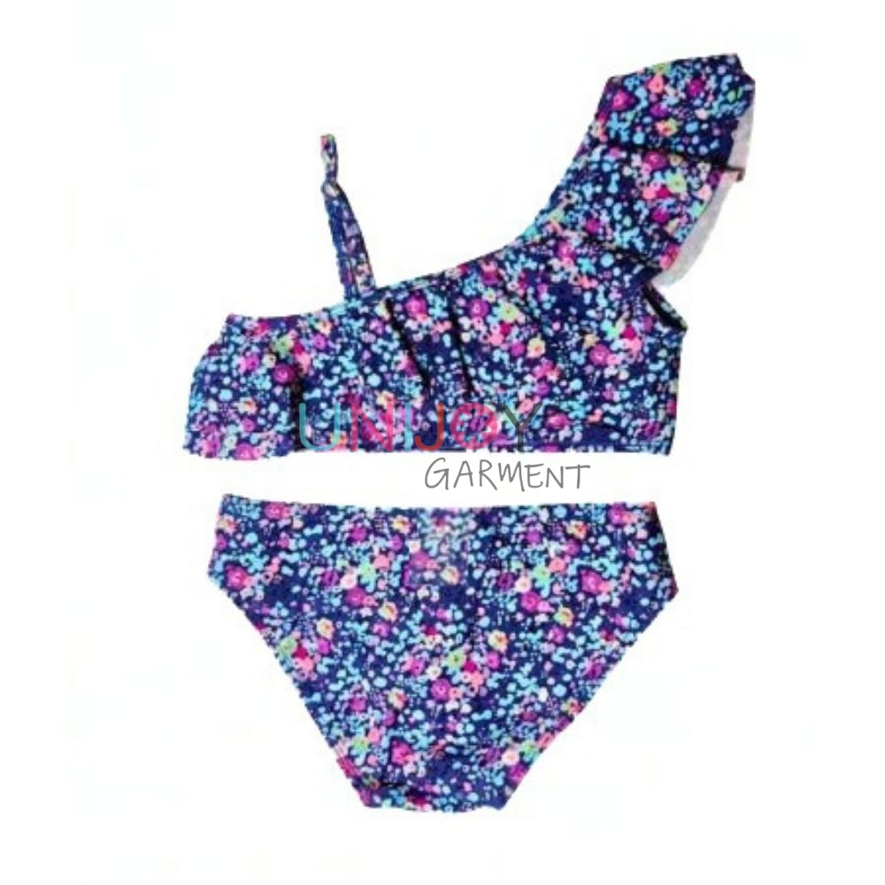 Back view of girls' two-piece swimsuit showing the adjustable strap, semi-open back ruffle, and classic swim bottoms